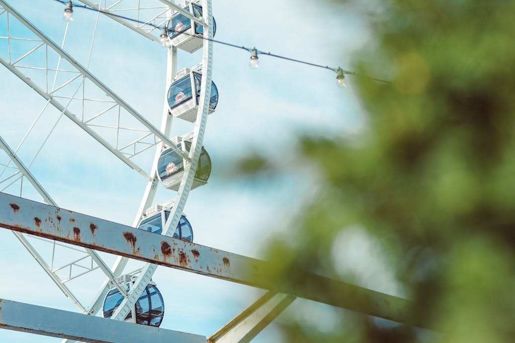 Close-up view of a Ferris wheel at a St. Louis amusement park on a sunny day.